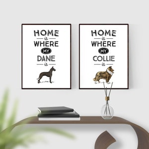 May include: Two framed prints with the text "Home is where my Dane is" and "Home is where my Collie is". Each print features a dog illustration. The Dane is black, and the Collie is brown and white.