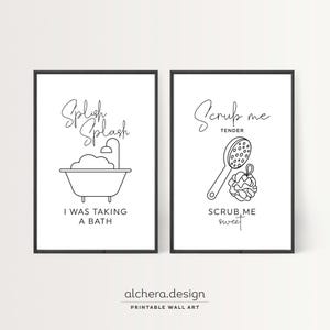 Two framed black and white line art prints: one of a bathtub with "Splish Splash I was taking a bath" and one of a loofah with "Scrub me tender scrub me sweet."