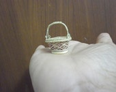mini baskets made from rattan and bamboo.they made as same really size with color, material and process. but they are mini item and beatiful