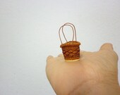 mini baskets made from rattan and bamboo.they made as same really size with color, material and process. but they are mini item and beatiful