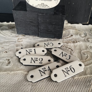 Enamel plate reissue of old EPPM Nun 0 to 99, sold individually.