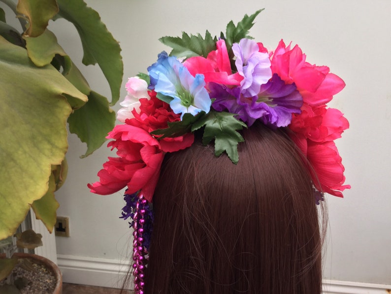 Headband with brightly coloured artificial flowers and strands of beads Inspired by Frida Kahlo.