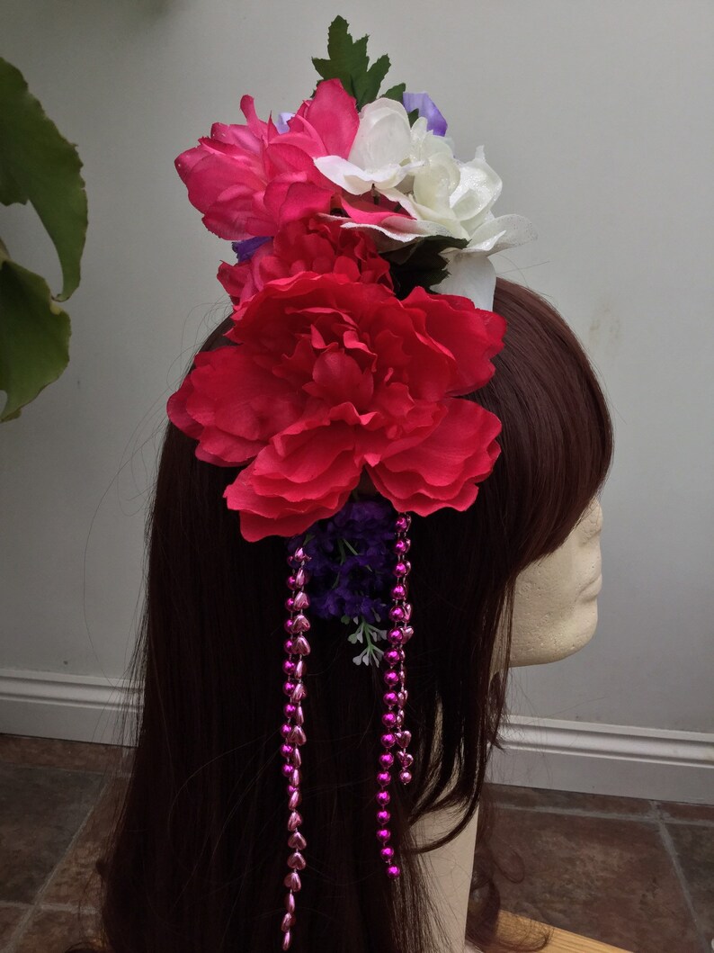 Headband with brightly coloured artificial flowers and strands of beads Inspired by Frida Kahlo.