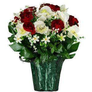 May include: A bouquet of artificial flowers in a green pot. The bouquet includes red roses, white orchids, and small white flowers.
