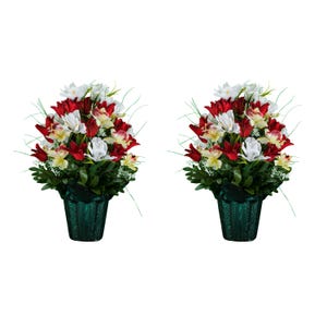 May include: Two floral arrangements featuring red, white, and yellow flowers with green foliage. The flowers are arranged in dark green textured pots. The background is plain white.