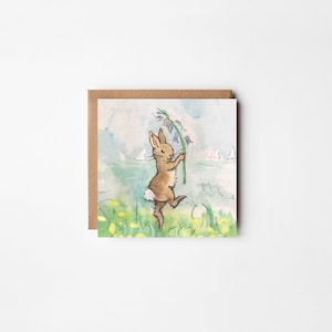 May include: A watercolour illustration of a brown rabbit holding a sprig of bluebells in a field of yellow flowers. The rabbit is dancing and smiling. The background is a light blue sky with white clouds.