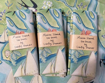 Sturdy Tea Towel, Mersea Island illustrated map, sailing boats, red squirrels, oysters, beach huts, unbleached cotton.