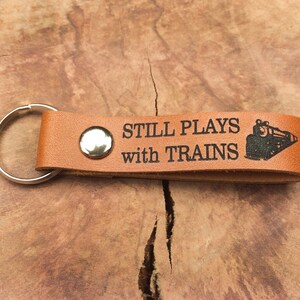 Train Lover Gift / Still Plays With Trains Keychain, Thick Premium Leather Keyring, Personalised,Laser Etched, Christmas, Railroader Gift