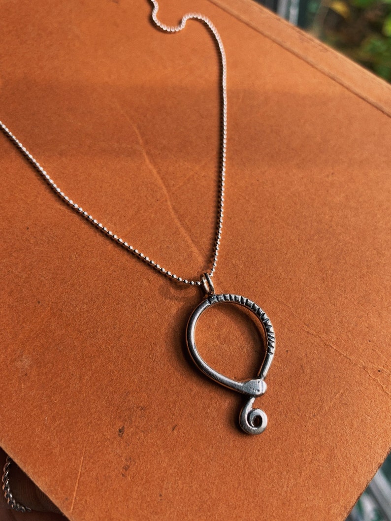 Solid Silver Ouroboros necklace. Dainty silver Ouroboros pendant Solid Silver Ouroboros necklace. Dainty silver Ouroboros pendant
