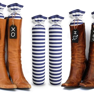 May include: Four pairs of brown leather boots with blue and white striped fabric shoe inserts. The inserts have tags that say "XO", "XO", "I heart you", and "YOU".