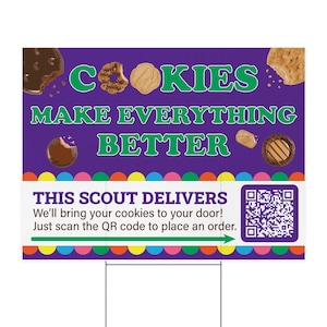 May include: A purple yard sign with the text "COOKIES MAKE EVERYTHING BETTER" in green. The sign also says "THIS SCOUT DELIVERS" and includes a QR code. The sign is decorated with images of cookies and a colorful border.