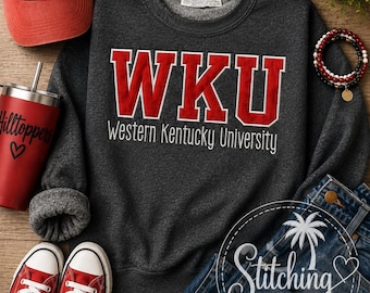 May include: A dark grey crewneck sweatshirt featuring the red and white embroidered text WKU and Western Kentucky University, paired with a red baseball cap, red tumbler, red trainers, blue jeans, sunglasses, and a beaded bracelet.