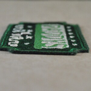 May include: Green and white embroidered patch with the text "Las Vegas" and a star.