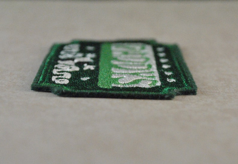 May include: Green and white embroidered patch with the text "Las Vegas" and a star.