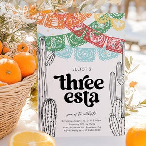 May include: A colorful invitation with a cactus and paper banners that says "ELLIOT'S three esta" and includes the text "join us to celebrate Saturday, August 22, 2:30-5:00pm Bouncing Off the Walls. 1234 Anywhere St. Anyplace, CA RSVP: Molly text 123-456-7890"
