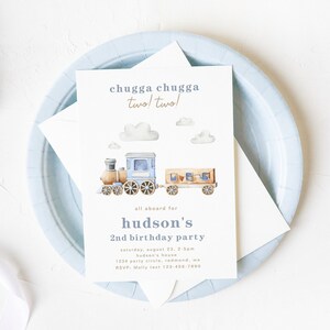 May include: A blue and brown train with white clouds on a white background. The text on the invitation reads "chugga chugga two! two!" and "all aboard for hudson's 2nd birthday party".