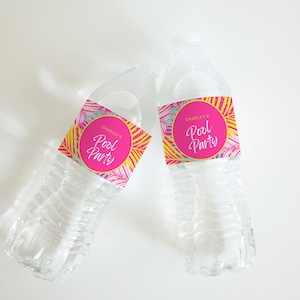 May include: Two clear plastic water bottles with colourful labels that say "Charley's Pool Party".