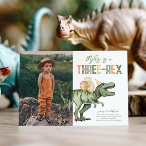 May include: A birthday invitation with a green dinosaur illustration and the text "Myles is a THREE-REX". The invitation has a photo of a young boy wearing a brown hat and overalls.
