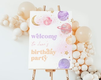 May include: Welcome to Luna's birthday party sign with a pink and purple watercolor background featuring planets, stars, and a crescent moon.