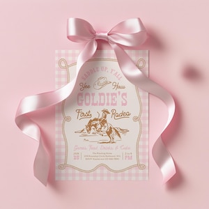 May include: A rectangular invitation card with a light pink and white gingham pattern, topped with a large pink satin ribbon bow. The text reads: Saddle Up, Y'all, Yee Haw, Goldie's First Rodeo, Games, Food, Drinks & Cake, Jan 25, 2 to 4 PM.