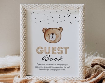 May include: White framed sign with a brown bear illustration and the text "GUEST Book" with instructions to write a special message on any page and sign your name.