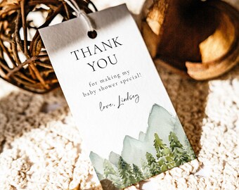 May include: White thank you tag with a watercolor illustration of a mountain range and pine trees. The text reads "Thank You for making my baby shower special! Love, Lindsey."