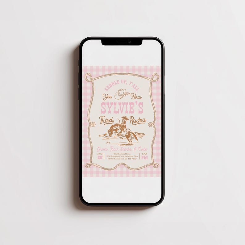 May include: A smartphone displaying a digital invitation with a light pink gingham background. The text reads: Saddle Up, Y'all, Yee Haw, Sylvie's Third Rodeo. It features a brown illustration of a cowboy on a bucking horse and a rope border.