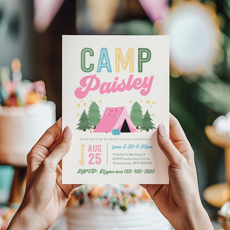 May include: A cream-colored invitation with the text "CAMP Paisley" in colorful letters. Below the text is a pink tent illustration with green trees and stars. The invitation includes event details: date, time, and location.