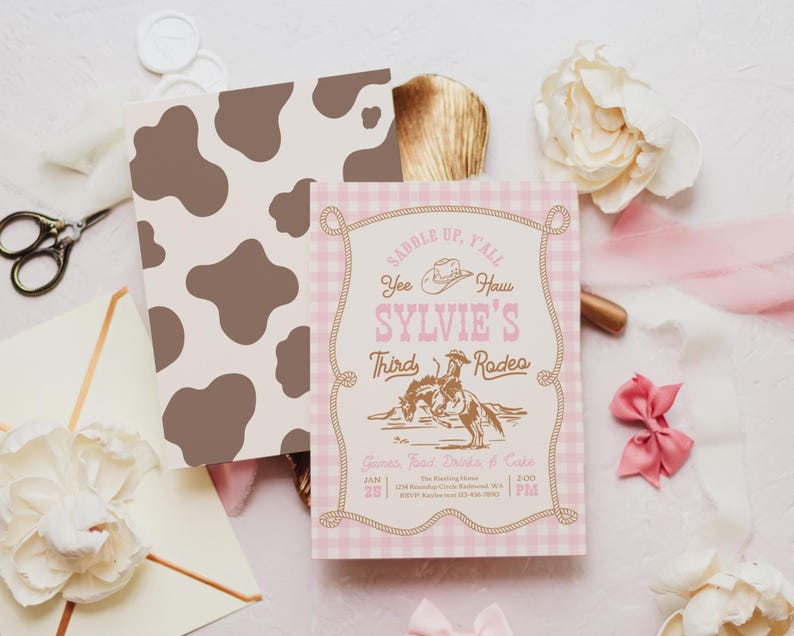 May include: A rectangular invitation card with a light pink gingham border and a rope frame design. The text reads: SADDLE UP, Y'ALL, Yee Haw, SYLVIE'S Third Rodeo, Games, Food, Drinks & Cake, JAN 25, 2:00 PM. It features a brown cowboy illustration.