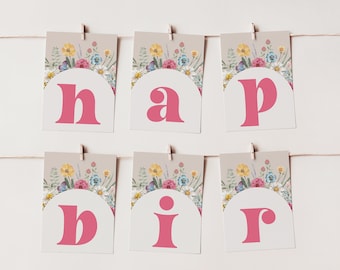 May include: A pink and white banner with floral designs and the word "happy" spelled out in pink letters.