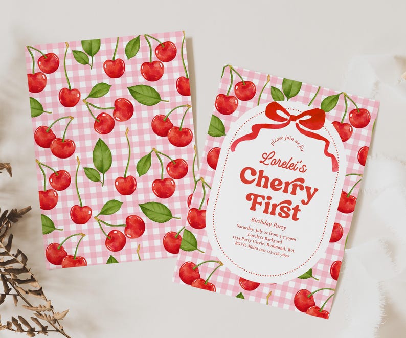 May include: Two invitation cards with a pink gingham pattern and red cherries. One card features the text "Lorelei's Cherry First Birthday Party" in red. The cards are designed for a birthday celebration.