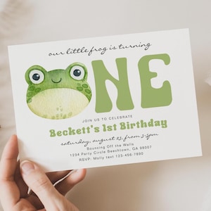 May include: A light green and white invitation card featuring a watercolour frog illustration. The card reads "our little frog is turning ONE" and announces Beckett's 1st Birthday, with date, time, and RSVP information.