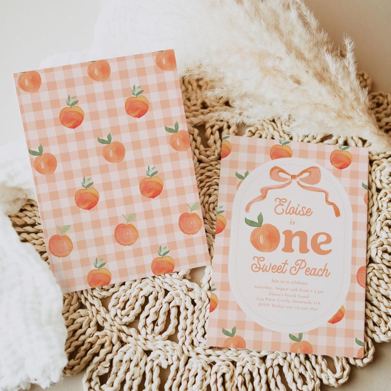 May include: Two peach-themed invitations. One features a peach and green gingham pattern. The other has an oval design with the text "Eloise is one Sweet Peach" and peach illustrations. The invitations are on a woven surface.