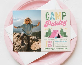 May include: A colorful invitation for a girl's 5th birthday party with a camping theme. The invitation features a photo of a girl wearing sunglasses and a blue shirt standing on a rock. The text on the invitation reads "Camp Paisley" and includes details about the party, including the date, time, and location.