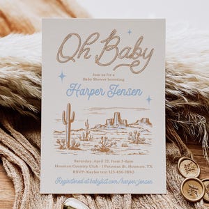 May include: A light beige baby shower invitation with a brown rope design that says "Oh Baby" in cursive. The invitation also includes a desert landscape illustration with cacti and mountains. The text on the invitation reads "Join us for a Baby Shower honoring Harper Jensen. Saturday, April 22, from 3-6pm Houston Country Club - 1 Potomac St. Houston, TX RSVP: Kaylee text 123-456-7890 Registered at babylist.com/harper-jensen"