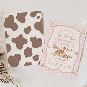 May include: Two rectangular cards. One features a brown and cream cow print pattern. The other has a pink and white gingham background with a rope border, a cowboy hat icon, and text reading "Saddle up, y'all", "Yee Haw", "Sylvie's Third Rodeo".