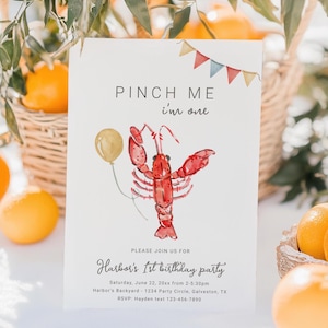 May include: A white invitation card with a watercolor illustration of a red lobster holding a yellow balloon. The text on the card reads "Pinch Me I'm One" and "Harbor's 1st Birthday Party". The invitation includes the date, time, location, and RSVP information.