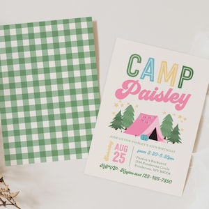 May include: A rectangular birthday invitation card featuring the text CAMP Paisley, a pink tent, green pine trees, and yellow stars, alongside a matching card with a green and white gingham pattern. The invitation includes event details.