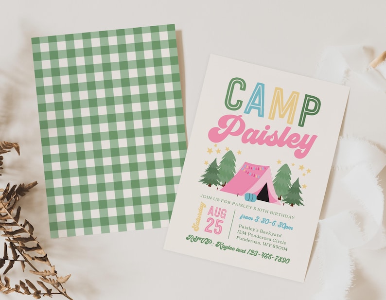 May include: A rectangular birthday invitation card featuring the text CAMP Paisley, a pink tent, green pine trees, and yellow stars, alongside a matching card with a green and white gingham pattern. The invitation includes event details.
