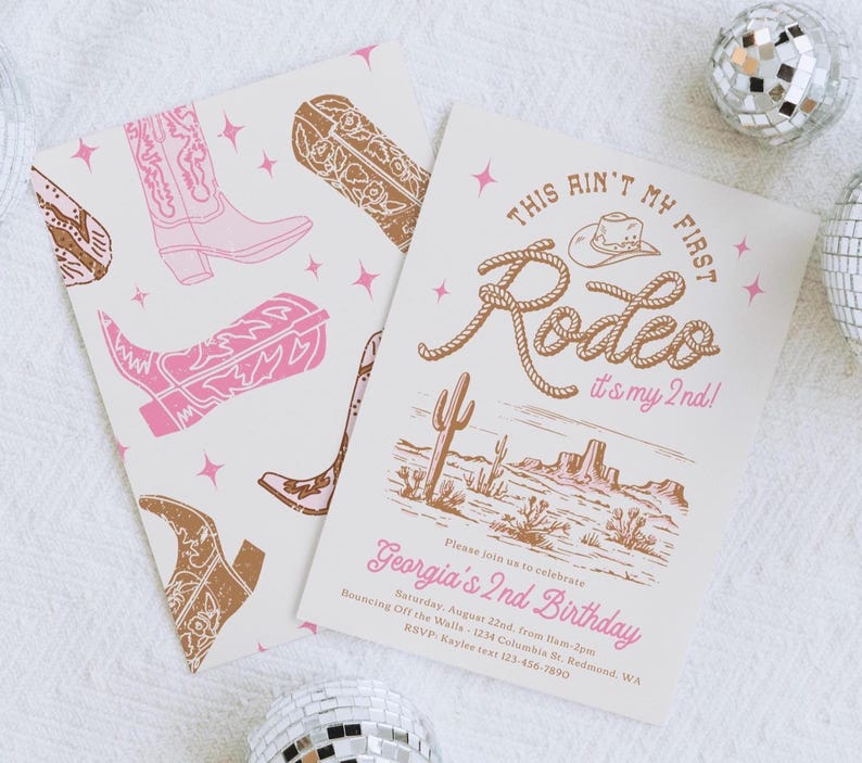 May include: Two rectangular invitation cards with a western theme. One card features a pattern of pink and brown cowboy boots and stars. The other card displays the text "THIS AIN'T MY FIRST Rodeo it's my 2nd!" above a desert landscape illustration.