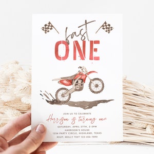 May include: A red and white motocross birthday party invitation with a red dirt bike jumping over a puddle of mud. The invitation says "Fast One" and includes the text "Join us to celebrate Harrison is turning one".