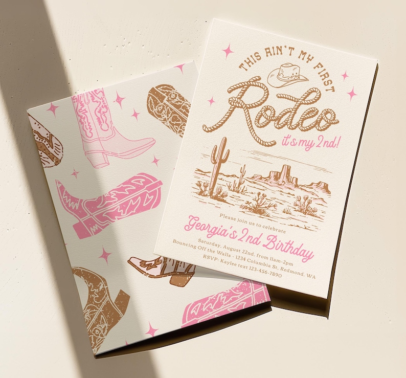 May include: Two rectangular birthday invitation cards featuring a western theme with pink and brown illustrations of cowboy boots, cacti, and stars. The text reads: This Ain't My First Rodeo it's my 2nd! Georgia's 2nd Birthday, date, and location.