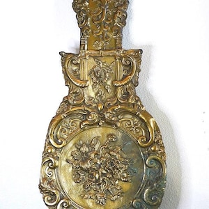 Péndulo de reloj ornamentado y dorado, siglo XIX