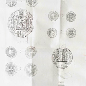 May include: A black and white illustration of a collection of historical seals. The seals are circular and feature various designs, including coats of arms, figures, and religious symbols.