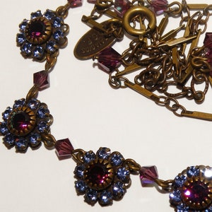 Liz Palacios Brass Blue and Red center stone flower Necklace.