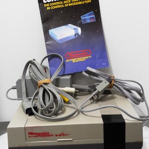 Nintendo NES Console, 3 Controllers, 3 Games & Most Wire Connections.