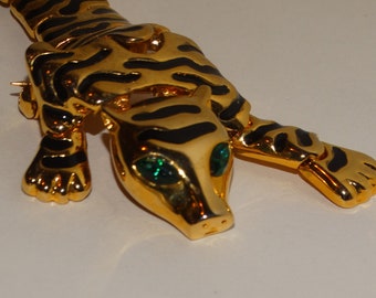 Gold Tone Green Eye Articulated Leopard brooch.