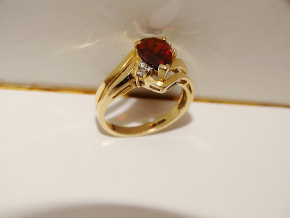 Garnet and diamond 14kt yellow gold ring deals