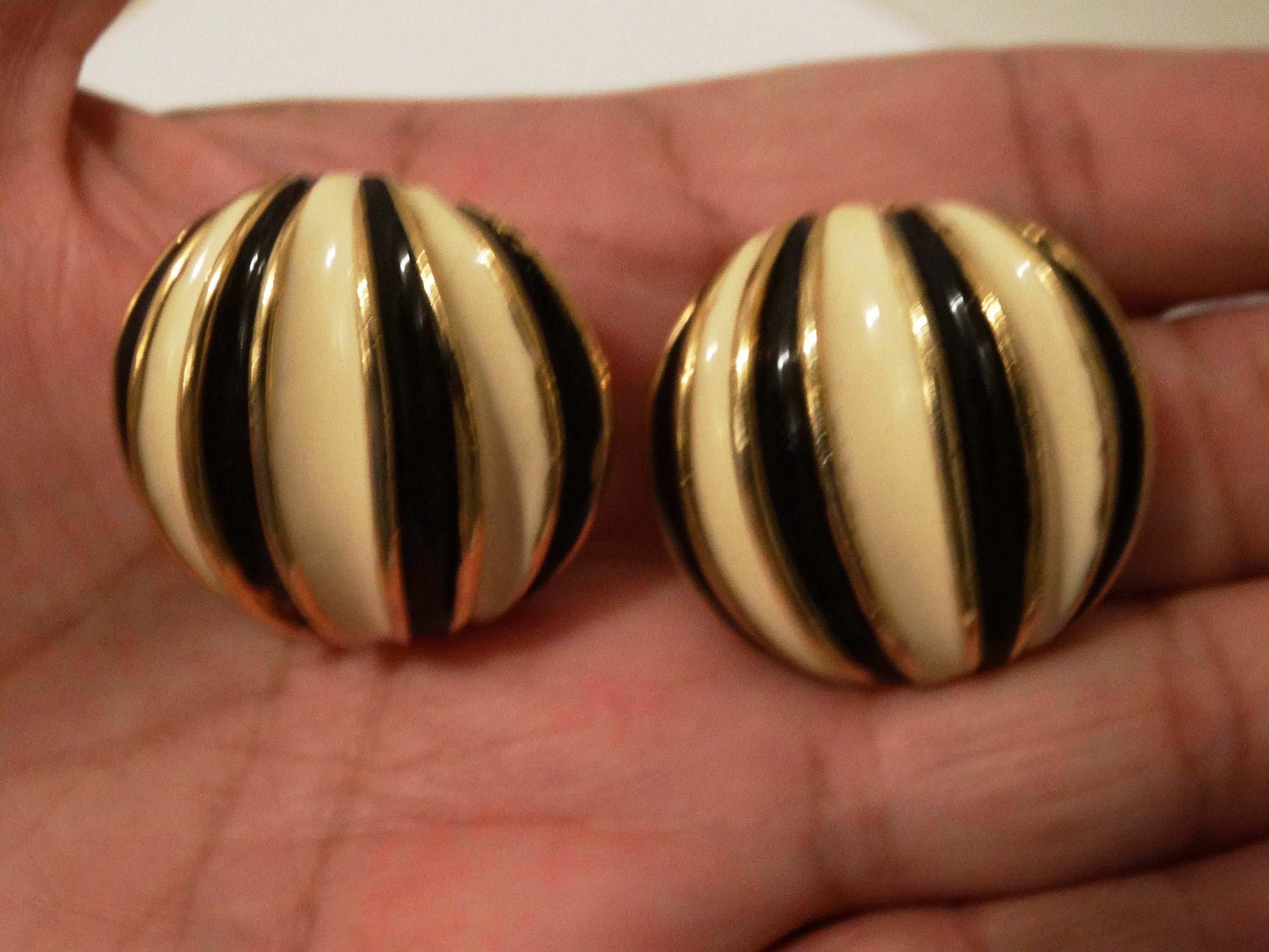 Gold Tone Metal Cream/Black Enamel Clip On Earrings.