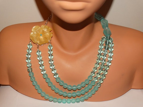 Blue Plastic/Lucite Triple Strand Beaded necklace. - image 1